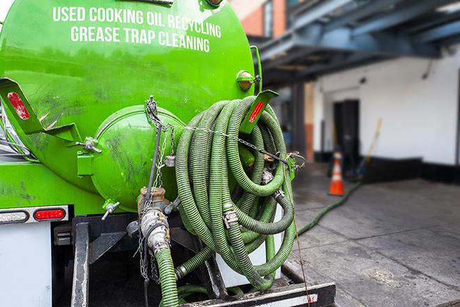 a professional service truck pumping a grease trap in Juliaetta, ID